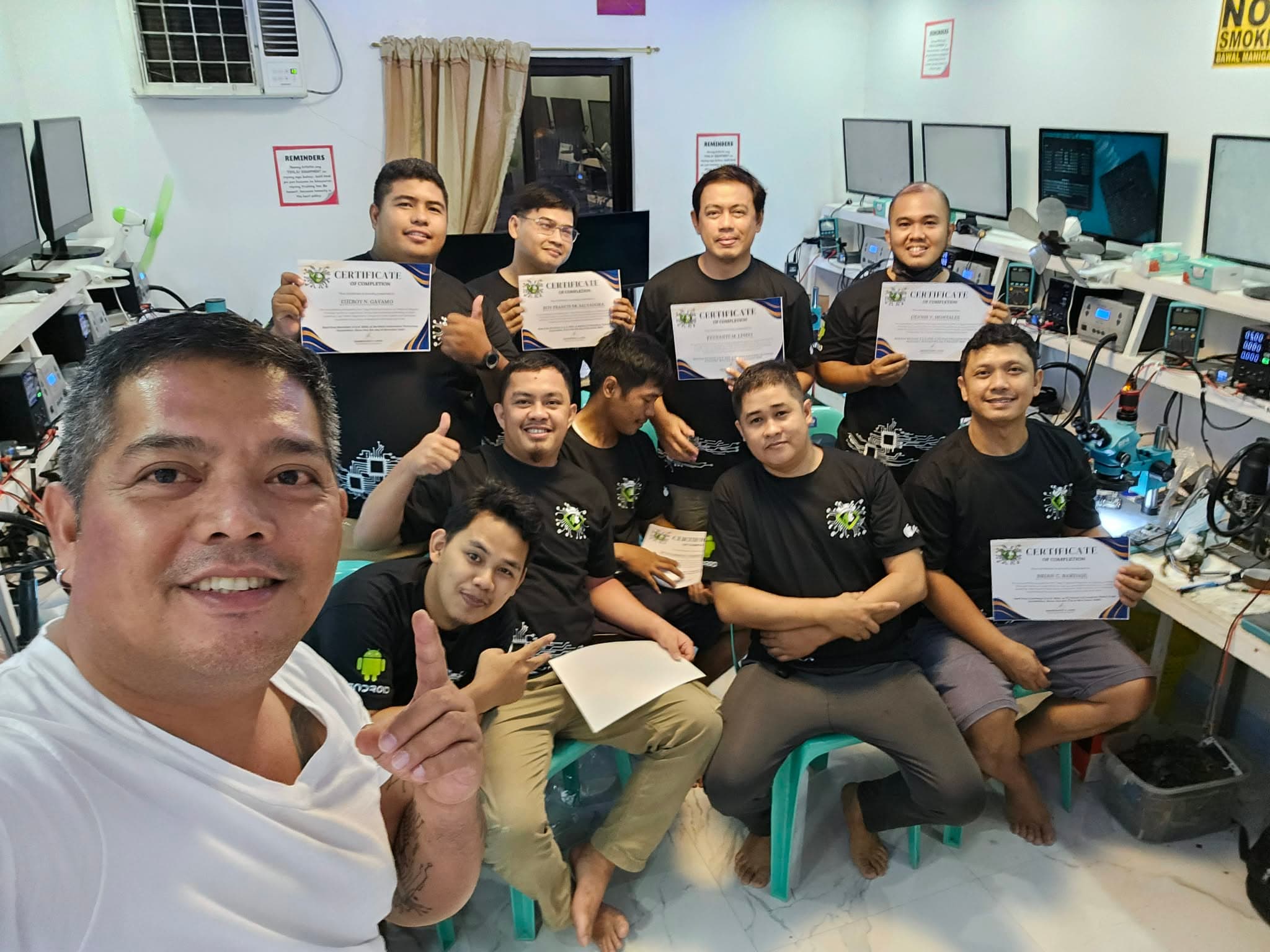 HardTech trainees and trainers holding completion certificates